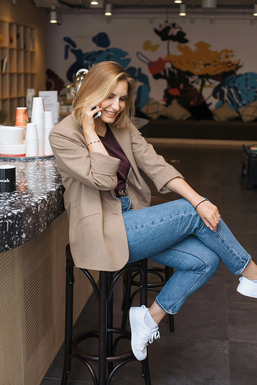 woman sitting while on a call